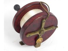 A wood & brass vintage fishing reel, 4.375in diame