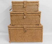 Three graduated baskets, faults with handles, larg