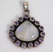 A silver mounted pendant set with moonstone & amet