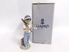A boxed Lladro figure of a boy, 7610, 'Can I Play'