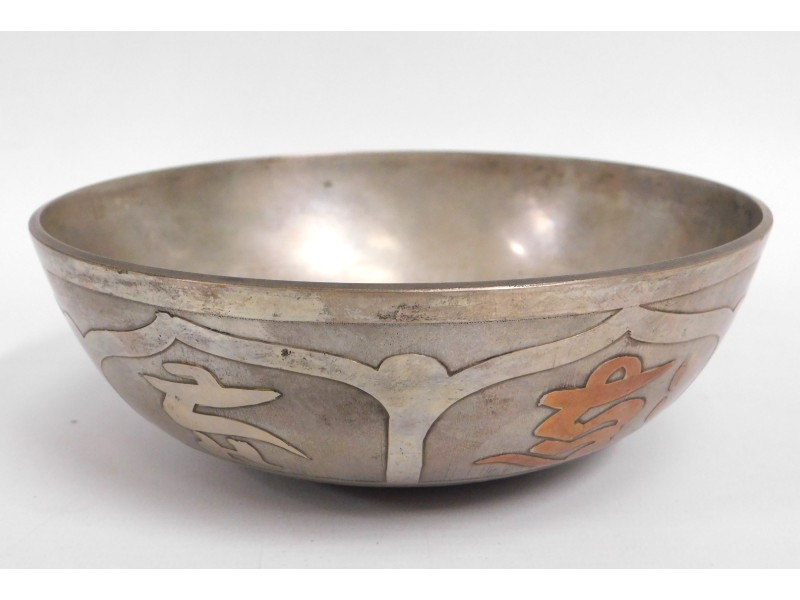 A silver on copper bowl with mixed silver & copper