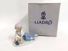 A boxed Lladro figure of a boy, 07619, 'All Aboard