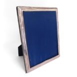 A 1993 Sheffield silver photo frame by Carrs, some