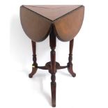 An antique triangular drop leaf mahogany table, 27