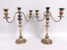 A pair of antique silver plate on copper candelabr