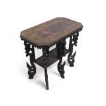 A carved ethnic style table with six legs, 28.5in