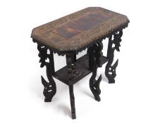 A carved ethnic style table with six legs, 28.5in