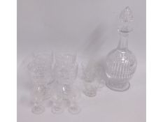 An antique cut glass decanter twinned with similar