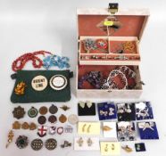 A quantity of costume jewellery & badges including