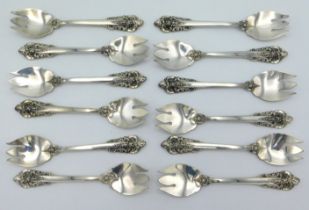 A set of twelve sterling silver sporks by Wallace