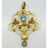 An Edwardian 9ct gold pendant set with topaz & pea