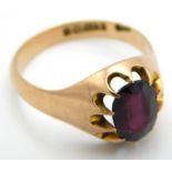 A 9ct rose gold ring set with garnet, main stone 9