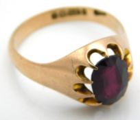 A 9ct rose gold ring set with garnet, main stone 9