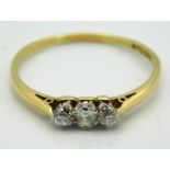 An 18ct gold ring set with three small diamonds, approx. 0.2ct, 1.6g, size R