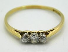 An 18ct gold ring set with three small diamonds, approx. 0.2ct, 1.6g, size R