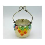 A Clarice Cliff conserve pot with embossed floral