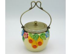 A Clarice Cliff conserve pot with embossed floral