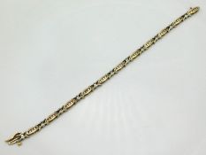 A 9ct two colour gold bracelet set with approx. 2.