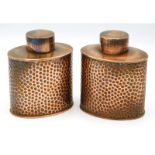 A pair of Joseph Sankey & Son hammered copper cadd