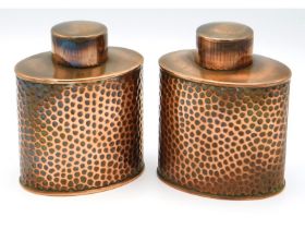 A pair of Joseph Sankey & Son hammered copper cadd