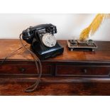 Tremaine Manor House: A vintage 164-53 bakelite telephone with contemporary plug some damage to hand