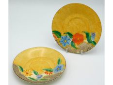 Two Clarice Cliff saucers, one Bizarre 'Canterbury