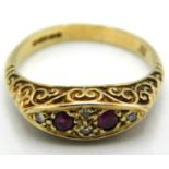 A 9ct gold ring with carved decor set with diamond