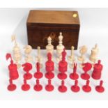 An antique carved bone chess set, lacking flag on