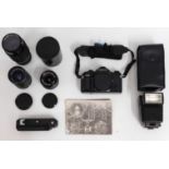 A Canon A-1 35mm SLR film camera with 35-70mm, 70-