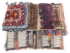 Five middle eastern carpet bags, largest 45in x 30