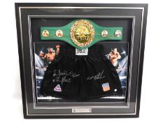 A cased pair of boxing shorts, hand signed by former world heavyweight champion 'Iron' Mike Tyson, a