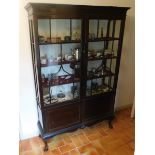 Tremaine Manor House: A mahogany display cabinet &