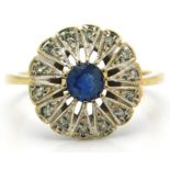 A 9ct gold ring set with diamonds & sapphire, 15mm