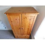 Ploughman's Cottage: A small pine wardrobe, 59in h
