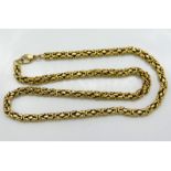 An 18in long yellow metal chain, tests electronica