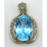 A 9ct gold pendant set with blue topaz & small dia