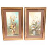 A gilt framed pair of floral watercolours, indisti