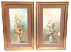 A gilt framed pair of floral watercolours, indisti