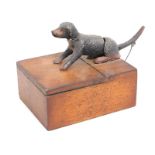 An antique articulated cigarette box with dog tail