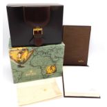 A boxed Rolex leather bound cigar case and notepad