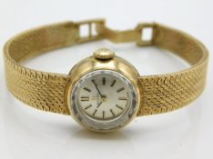 A ladies Omega wristwatch with 9ct gold case & str