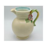 A Clarice Cliff jug with organic handle, 8.75in ta