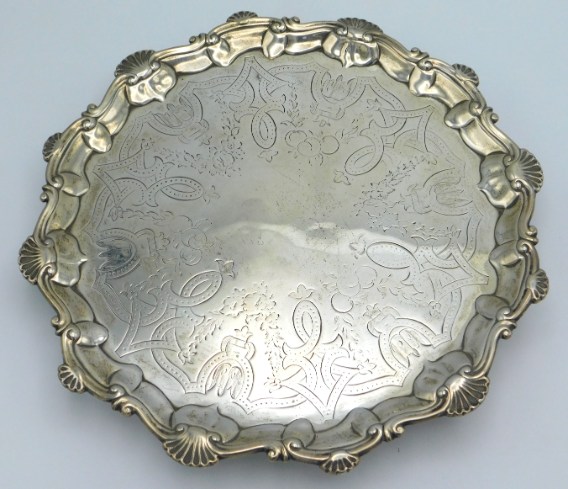 An early George III, 1763 London silver salver by Thomas Hannam & Richard Mills, 10in diameter. 469.