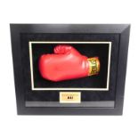 A cased boxing glove hand signed by former world heavyweight boxing champion & all time great, Muham