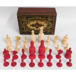 An antique carved bone chess set, two matched whit