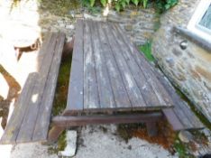 Ploughman's Cottage: A wooden picnic garden table,