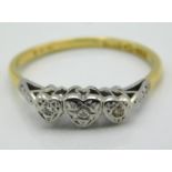 An antique 18ct gold ring with heart shaped platin