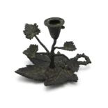 A 19thC. bronze chamberstick of organic design, 3i