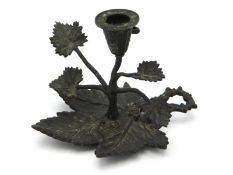 A 19thC. bronze chamberstick of organic design, 3i