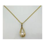 An 18ct gold chain with 14ct gold mounted pearl, chain 17in long, chain 2.2g, pendant 1.7g